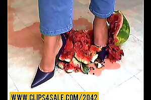 Watermelon crushing under brazen heels