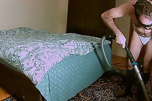 Lord cleans rub-down the bedroom with a vacuum cleaner