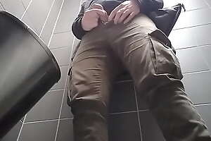 Young man with uncut dick peeing in a public urinal  He then shows and shakes his dick 